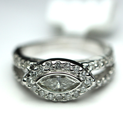 east west diamond ring setting with diamonds down the band
