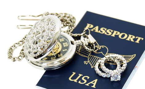 passport with diamond rings and a pocket watch